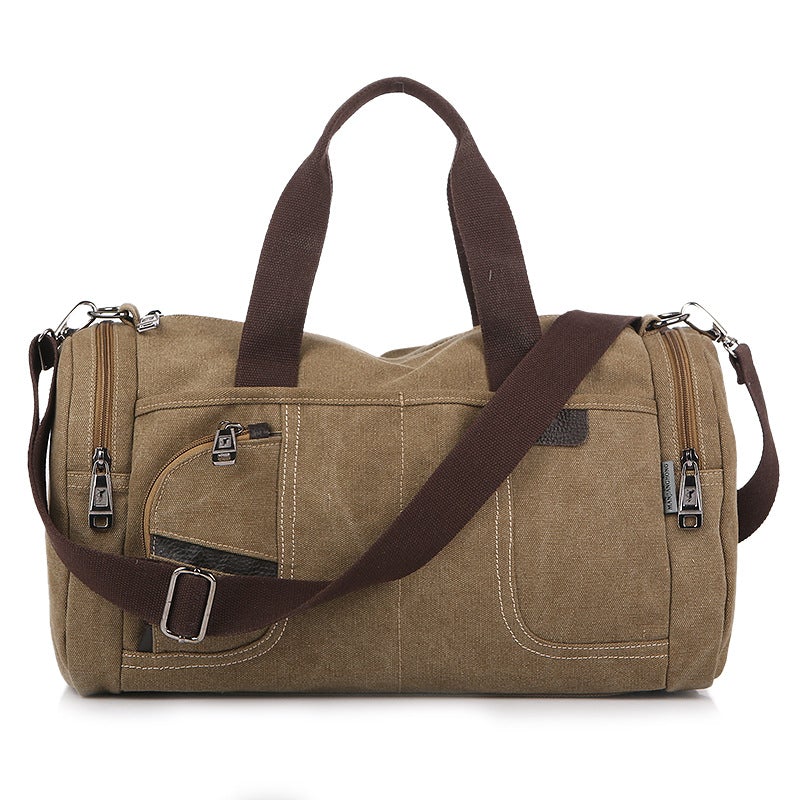 Large-capacity canvas duffel bag designed for hiking and tourism, featuring multiple pockets and a durable structure.