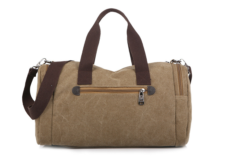 Large-capacity canvas duffel bag designed for hiking and tourism, featuring multiple pockets and a durable structure.