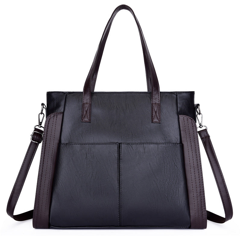 Large-capacity soft leather single-shoulder messenger bag in a stylish tote design, featuring a zipper closure and multiple internal pockets.