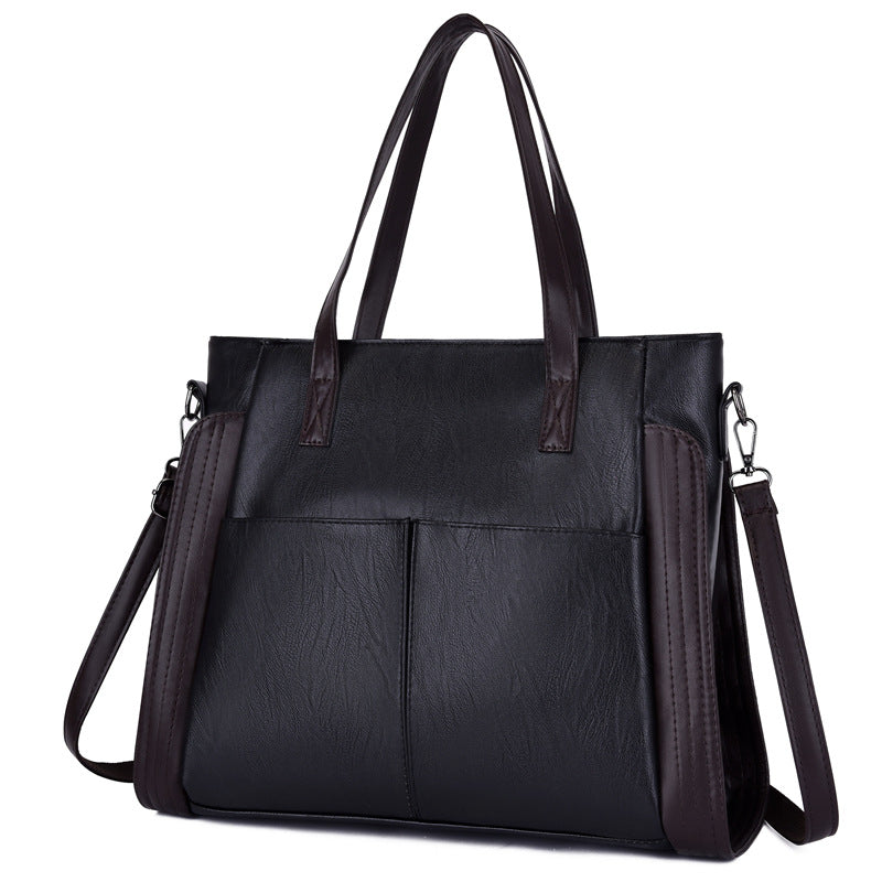Large-capacity soft leather single-shoulder messenger bag in a stylish tote design, featuring a zipper closure and multiple internal pockets.