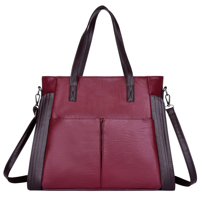 Large-capacity soft leather single-shoulder messenger bag in a stylish tote design, featuring a zipper closure and multiple internal pockets.