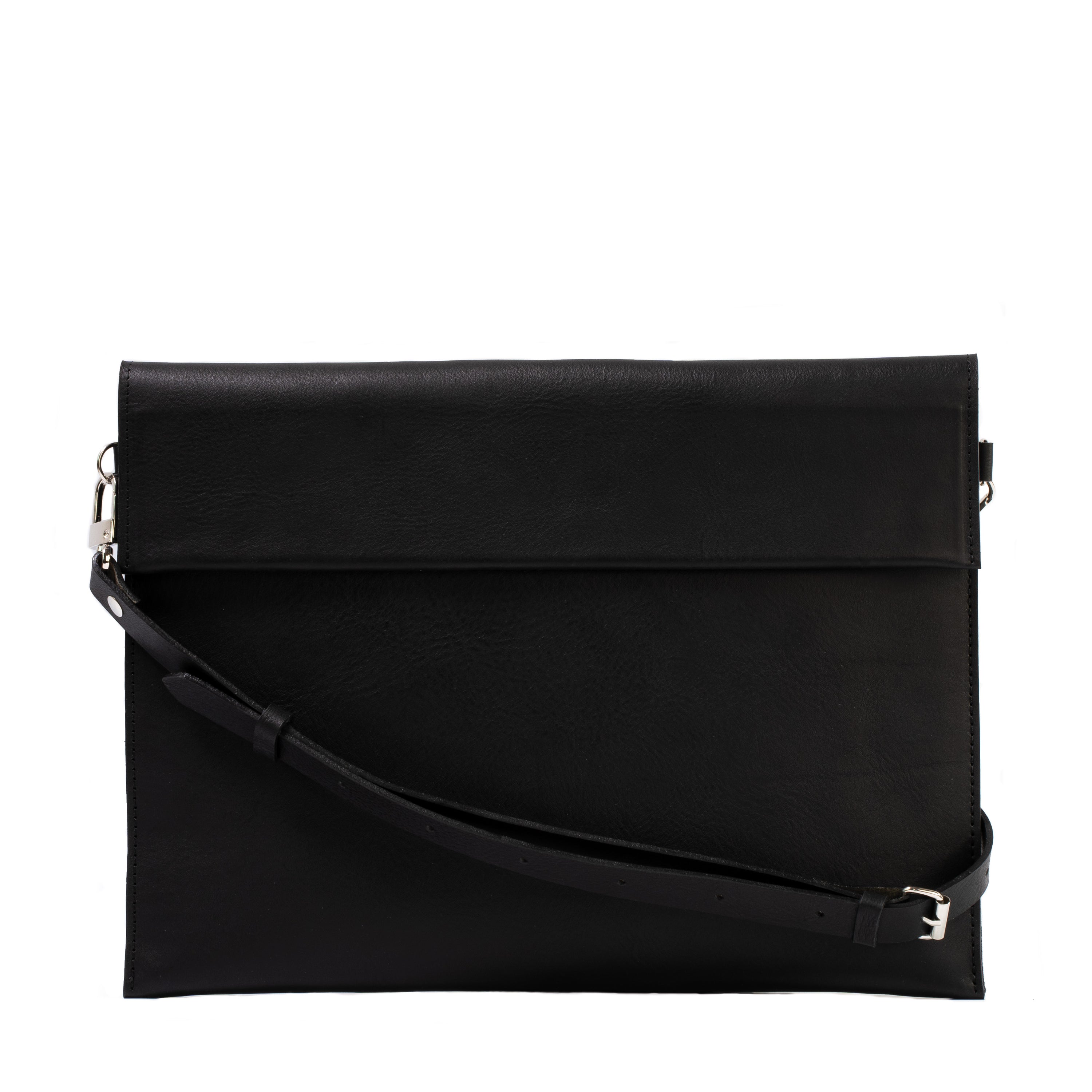 Elegant leather bag designed for iPad, featuring adjustable strap and magnetic closure, showcasing premium craftsmanship.