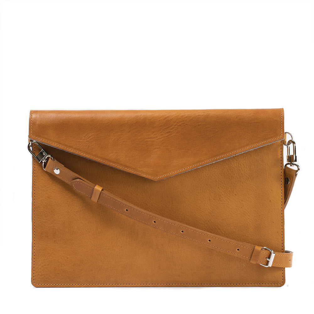 Premium leather bag for iPad with adjustable strap, showcasing its elegant design and wool felt lining.