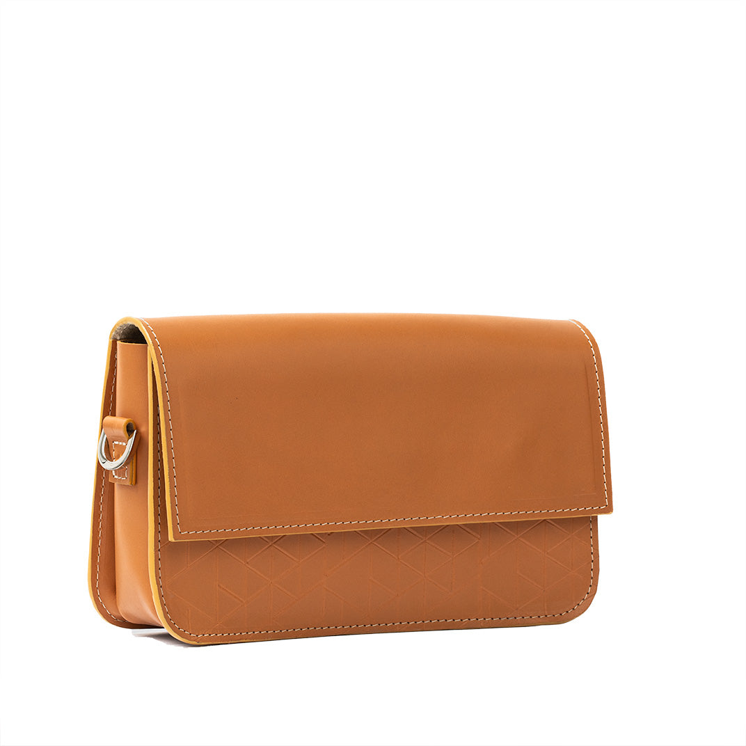Curie Leather Shoulder Bag in orange with geometric pattern, showcasing premium Italian leather and structured design.