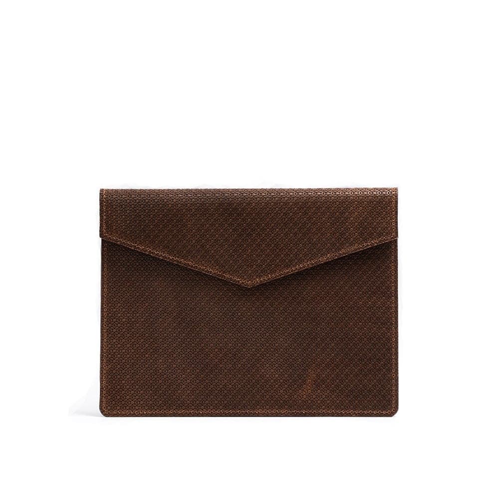 Luxurious leather sleeve for MacBook featuring a unique geometric embossed pattern, handcrafted from Italian vegetable-tanned leather.
