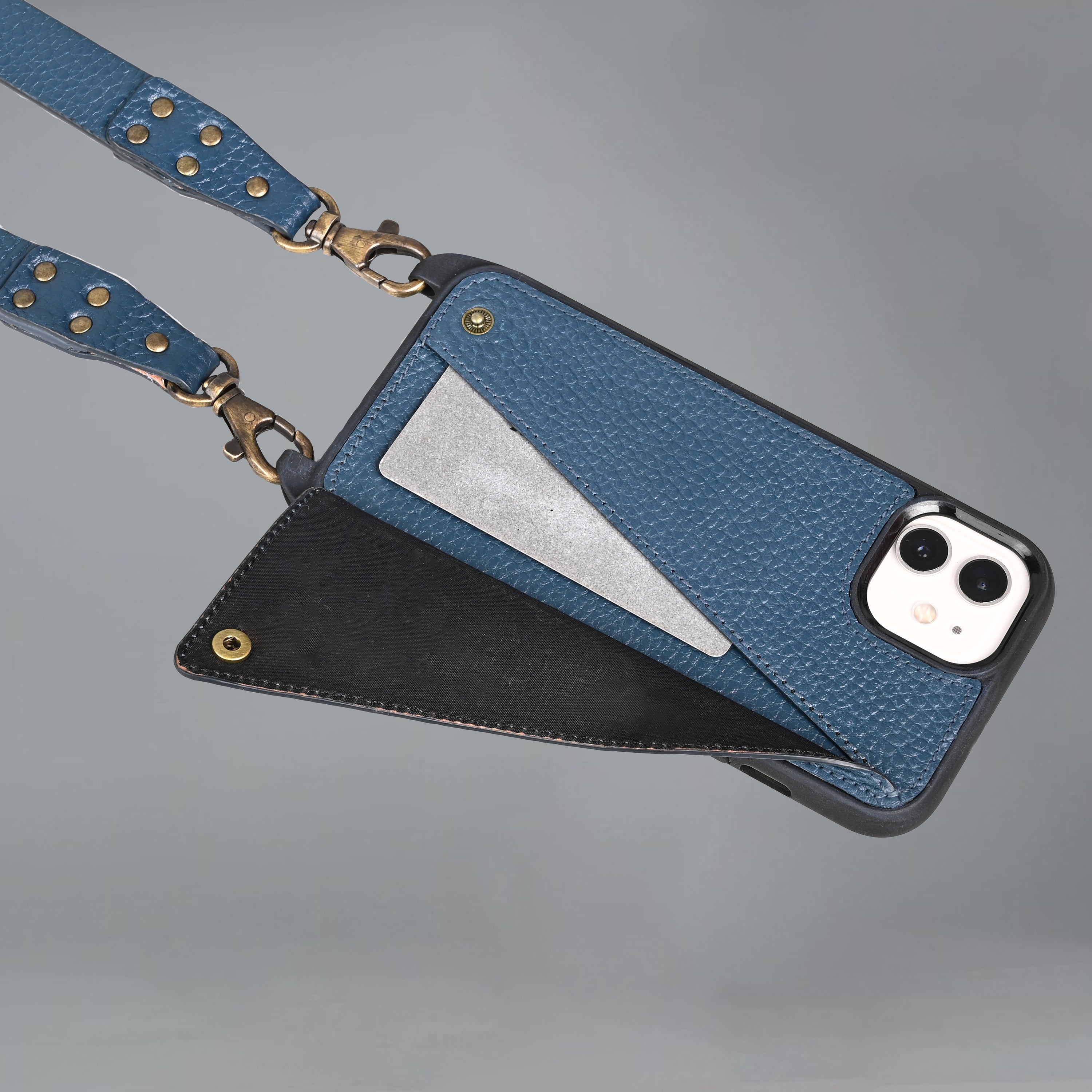 Lifestyle iPhone Case made of full grain leather with adjustable crossbody strap and external pocket for cash and cards.