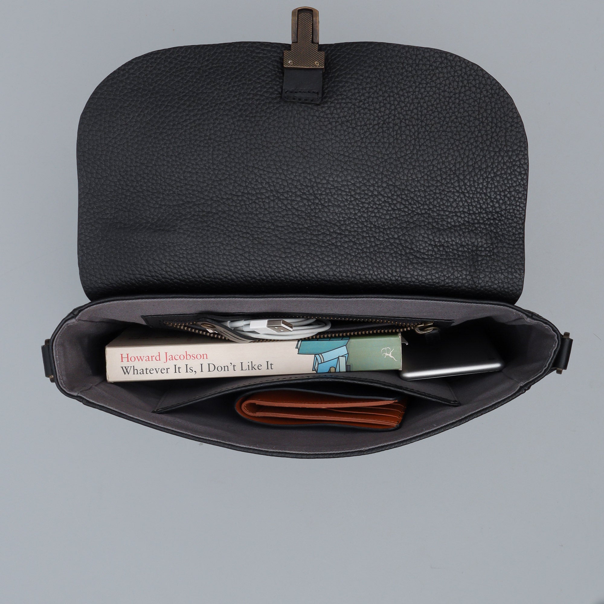 London Crossbody Bag made from premium full grain leather with vintage lock and multiple compartments.