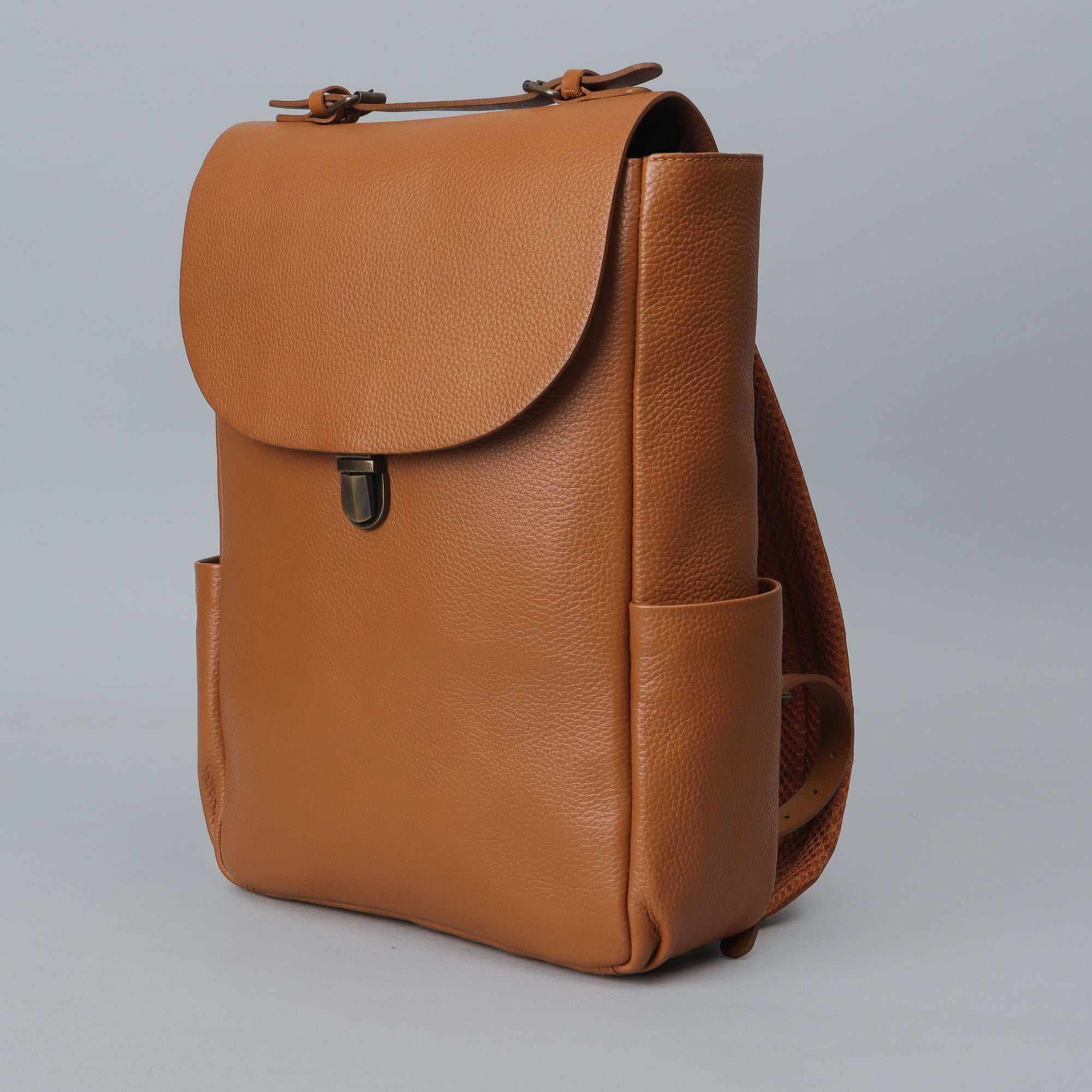 London Leather Backpack made from premium full grain leather, featuring multiple pockets, adjustable straps, and a sleek design.