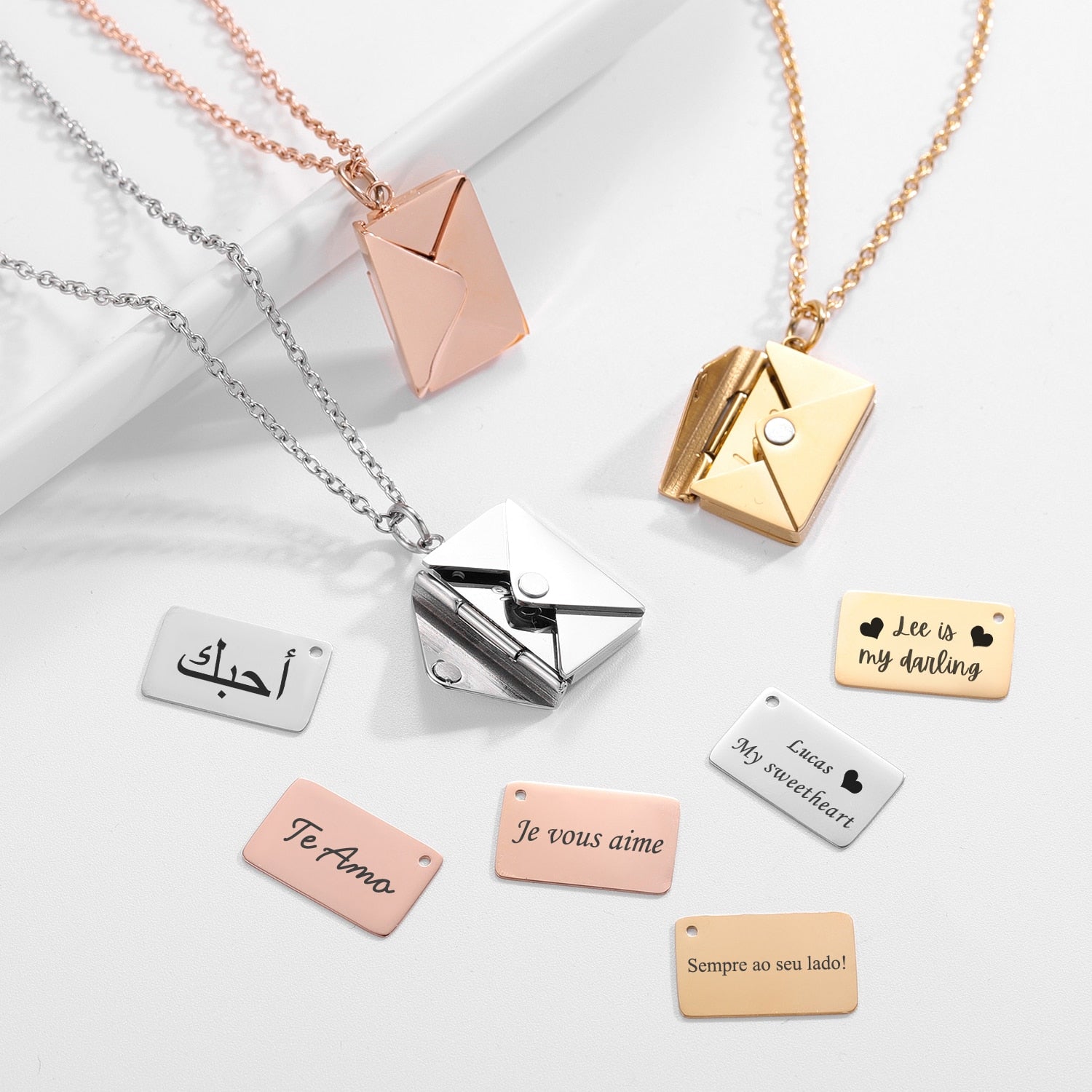 A beautiful Love Letter Envelope Pendant Necklace in gold, featuring customizable name engraving, elegantly displayed in a gift box.
