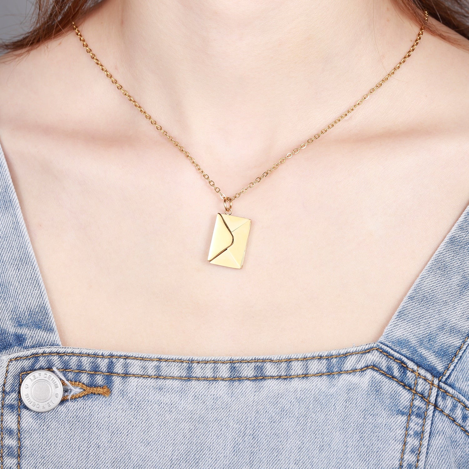 A beautiful Love Letter Envelope Pendant Necklace in gold, featuring customizable name engraving, elegantly displayed in a gift box.