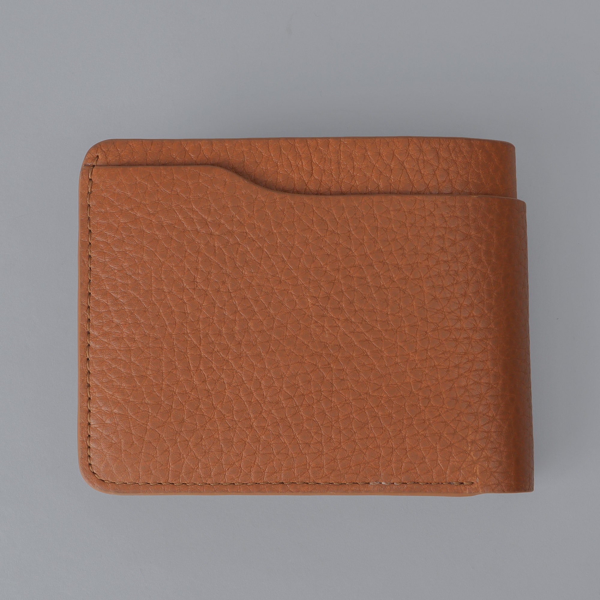 Max Wallet made from premium full grain leather with multiple pockets for cards and cash, featuring antique brass hardware and YKK zippers.