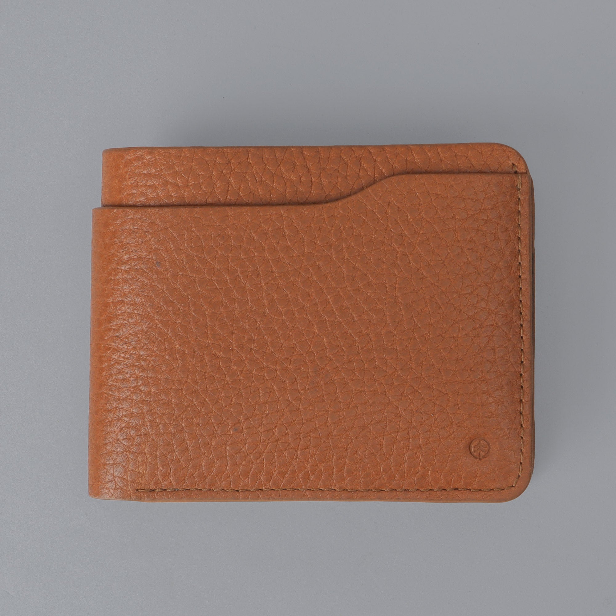 Max Wallet made from premium full grain leather with multiple pockets for cards and cash, featuring antique brass hardware and YKK zippers.