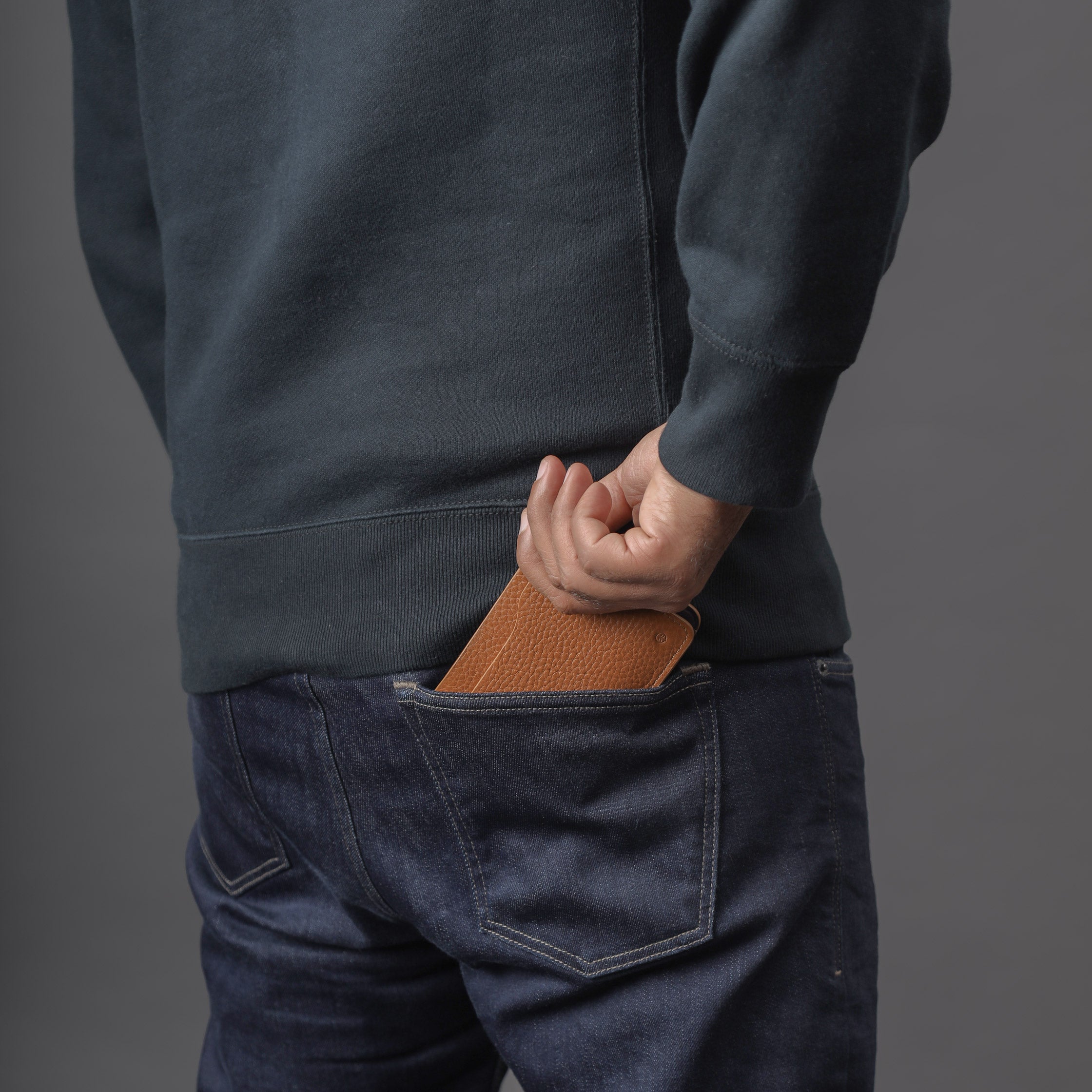 Max Wallet made from premium full grain leather with multiple pockets for cards and cash, featuring antique brass hardware and YKK zippers.