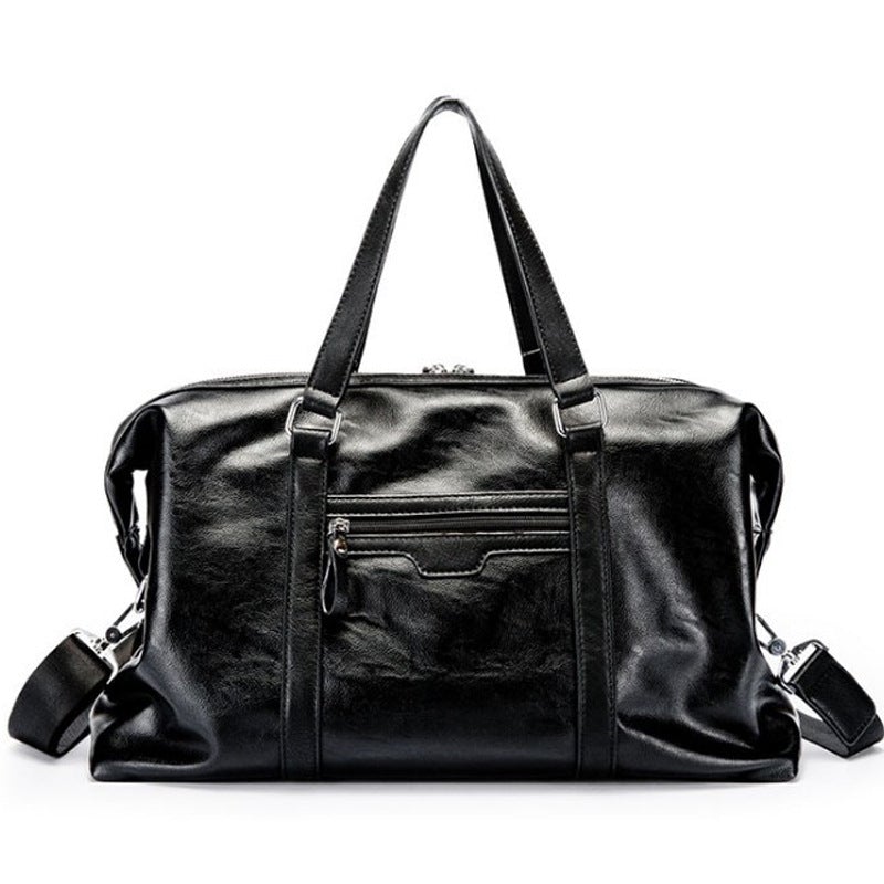 Men's waterproof leather travel bag in black, featuring multiple compartments and pockets for organization, ideal for business trips.