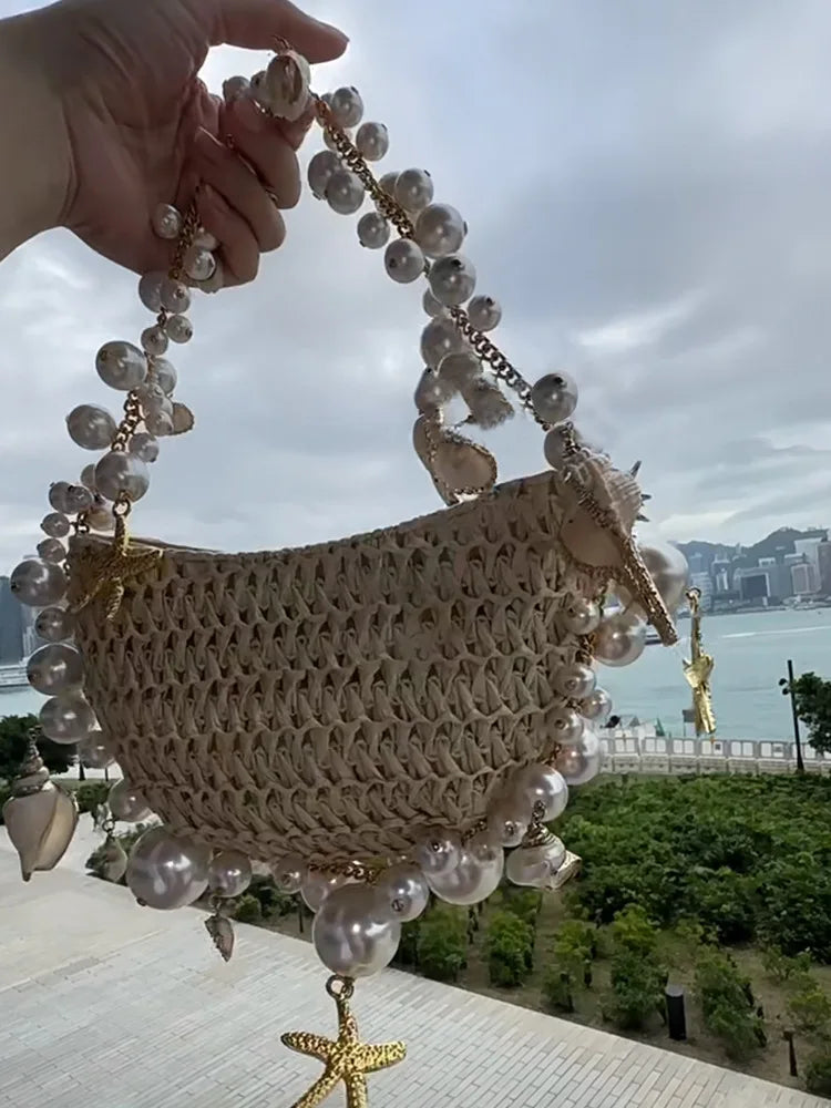 Mermaid Beach Bag by Sexikinis Swim featuring straw material, pearl and conch design, and elegant geometric pattern.