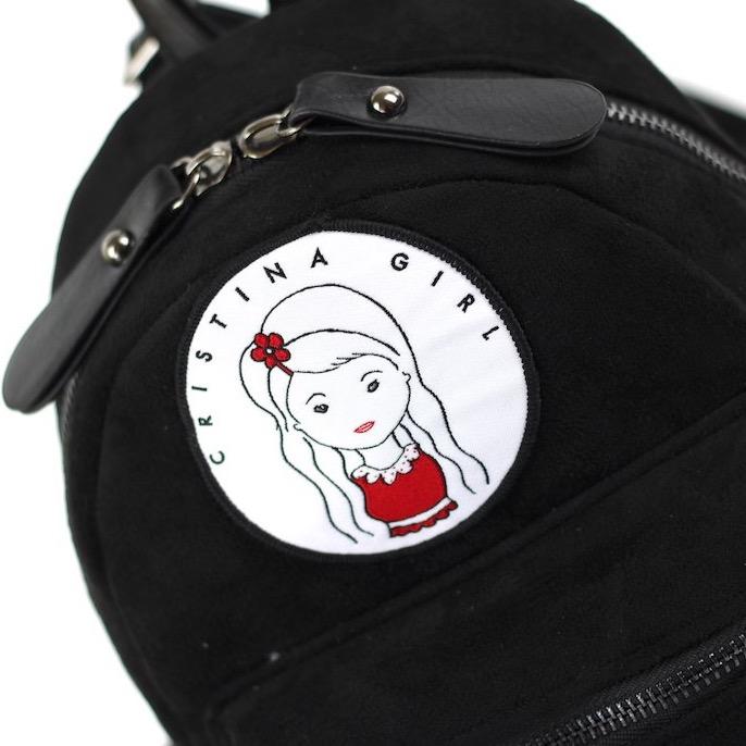 Micro Backpack in Faux Suede Leather with adjustable straps and zipped pockets, available in four colors.