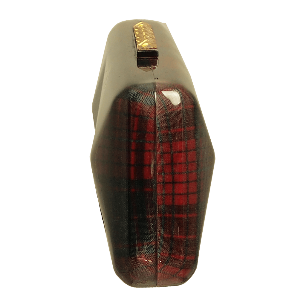 A stylish Minaudière in Red Tartan featuring hard glass acrylic, Swarovski Elements clasp, and a silk-lined interior.