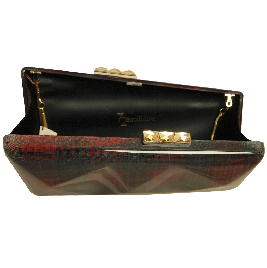 A stylish Minaudière in Red Tartan featuring hard glass acrylic, Swarovski Elements clasp, and a silk-lined interior.