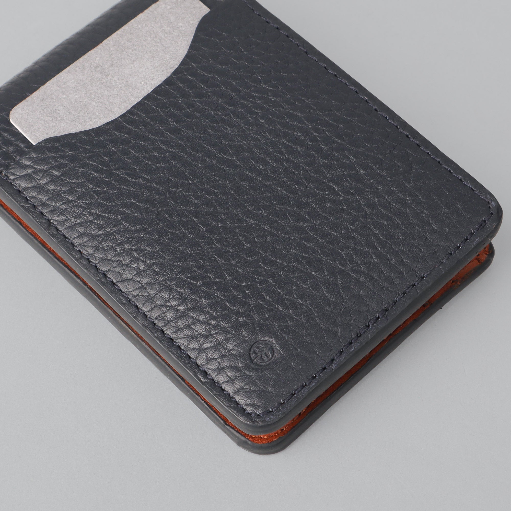 A sleek Minimal Wallet made of premium genuine leather, featuring multiple pockets for cards and cash, displayed on a neutral background.