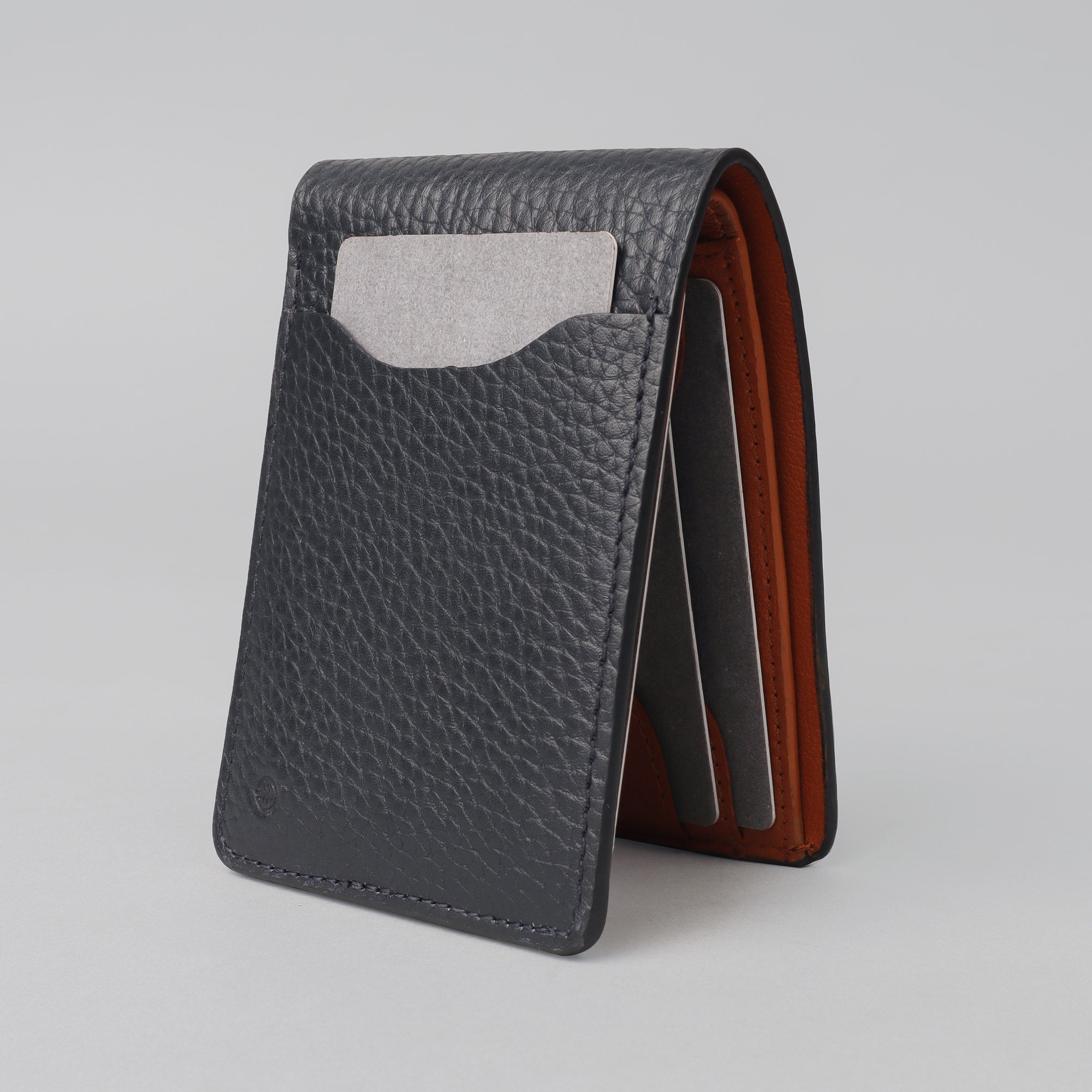 A sleek Minimal Wallet made of premium genuine leather, featuring multiple pockets for cards and cash, displayed on a neutral background.