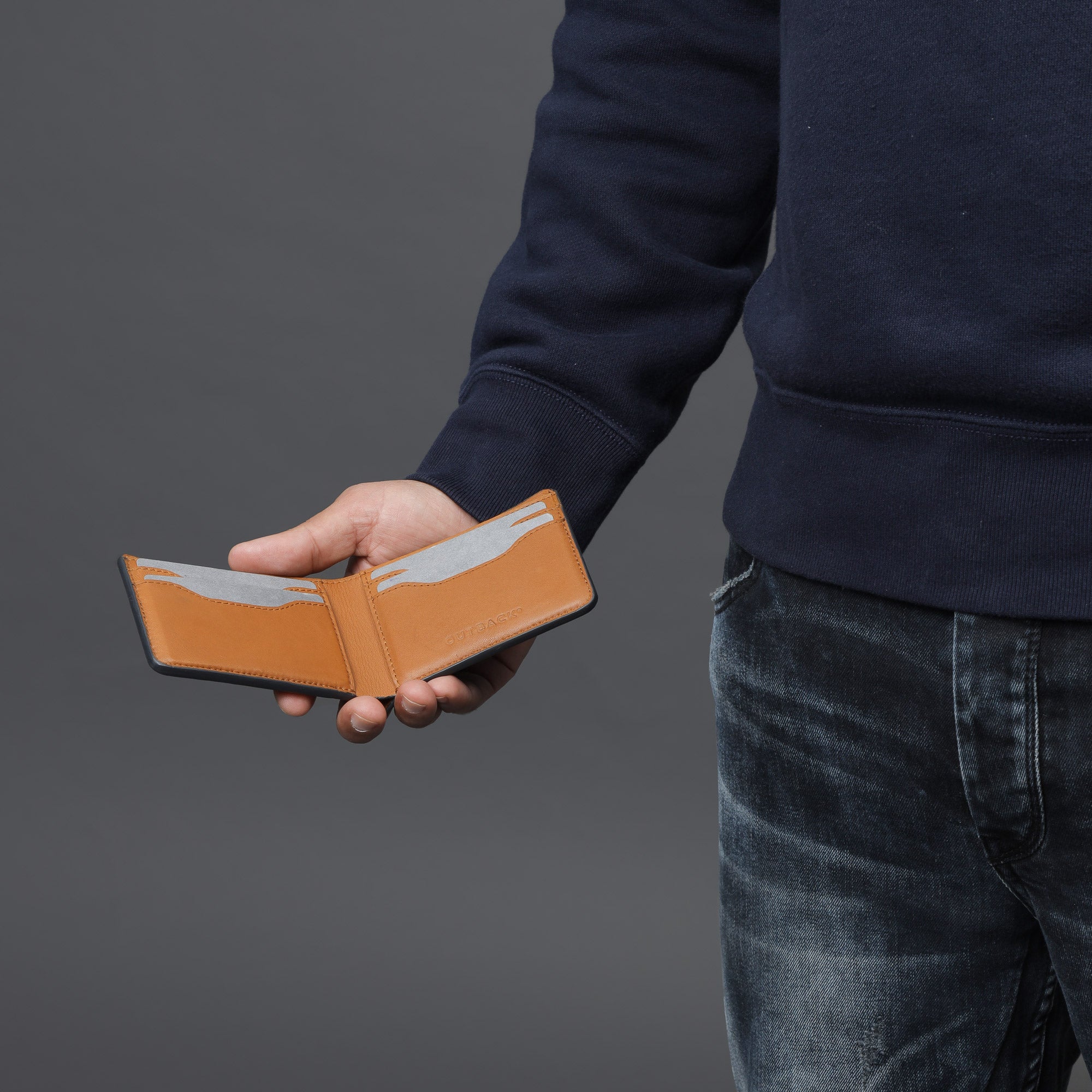 A sleek Minimal Wallet made of premium genuine leather, featuring multiple pockets for cards and cash, displayed on a neutral background.