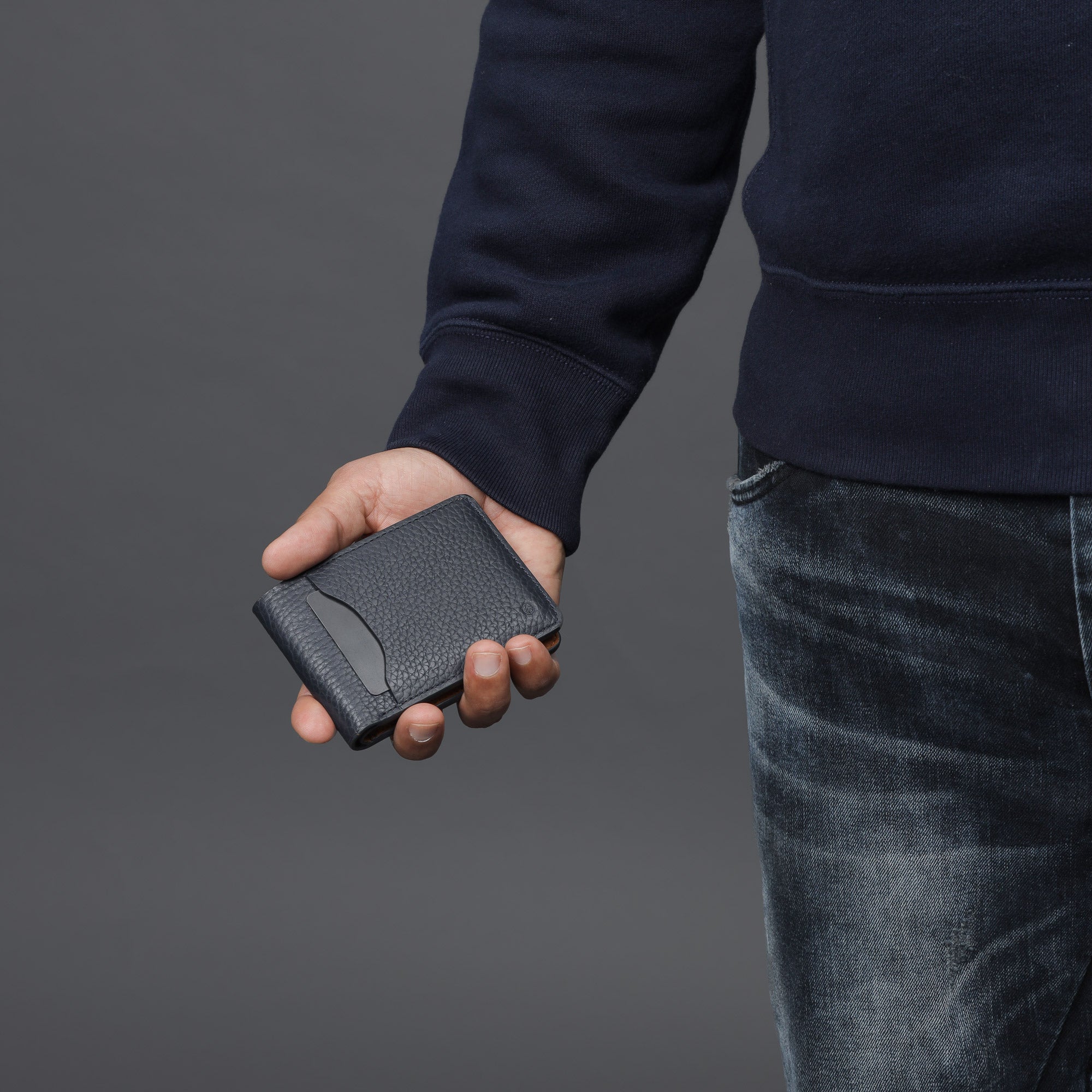 A sleek Minimal Wallet made of premium genuine leather, featuring multiple pockets for cards and cash, displayed on a neutral background.