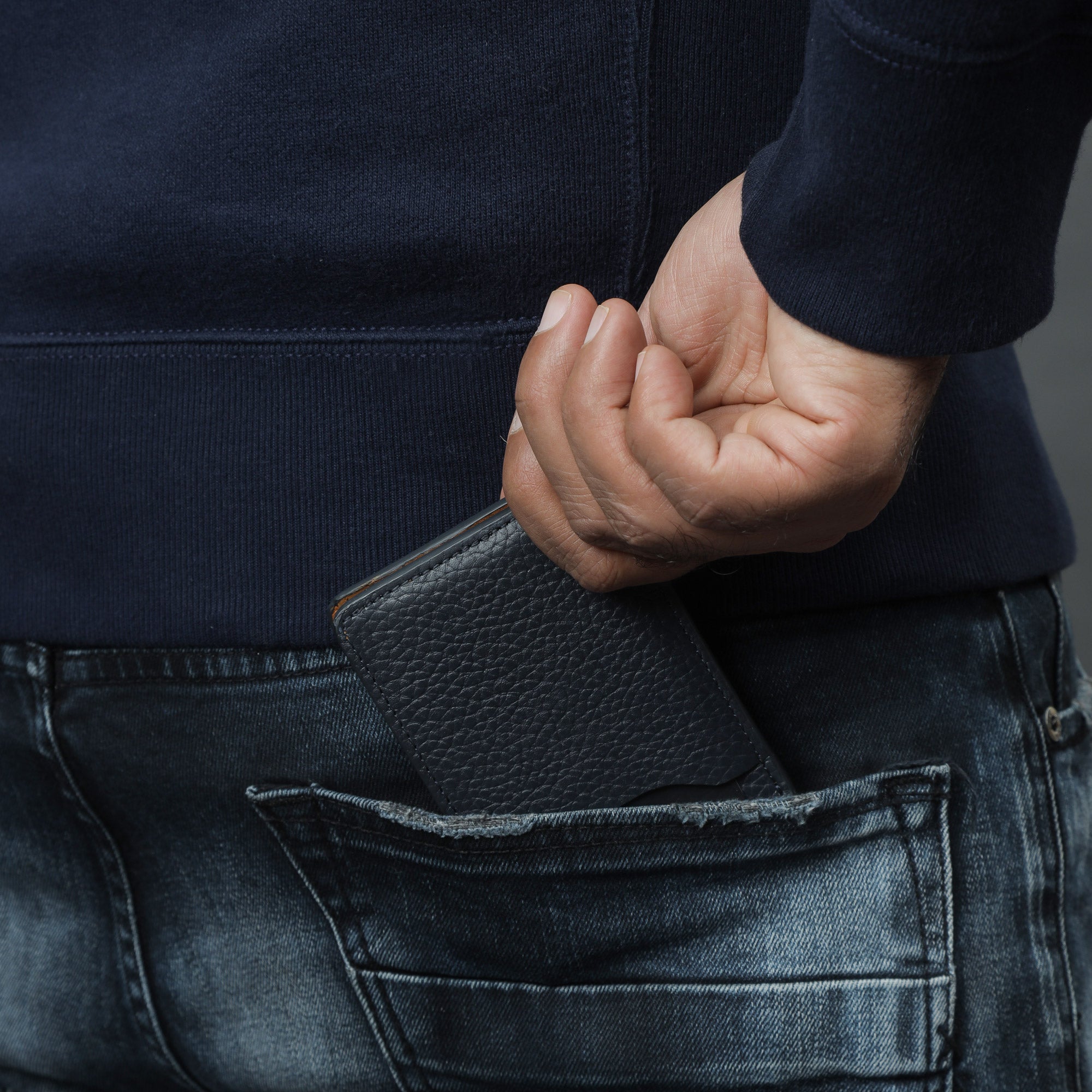 A sleek Minimal Wallet made of premium genuine leather, featuring multiple pockets for cards and cash, displayed on a neutral background.