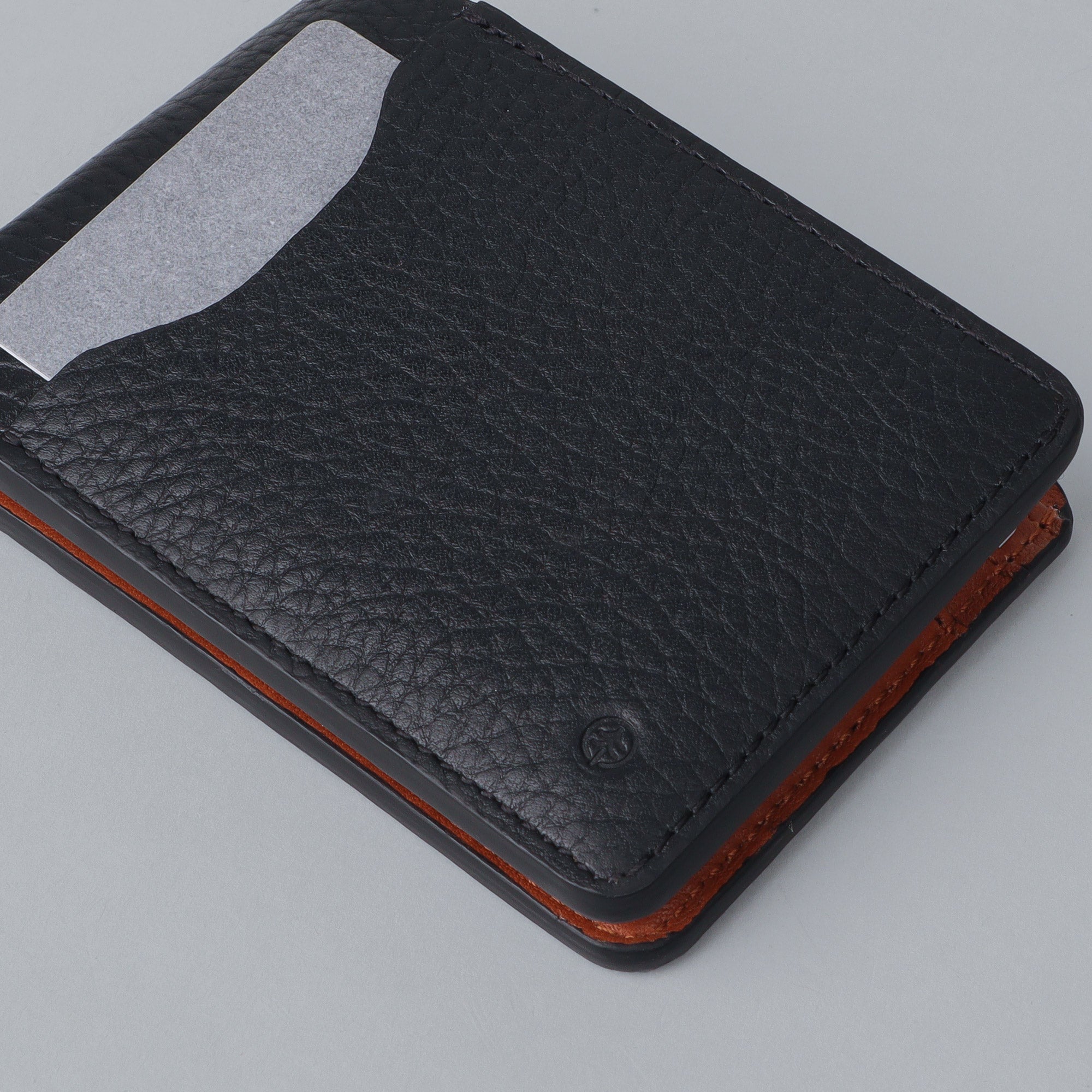 A sleek Minimal Wallet made from premium genuine leather, featuring multiple pockets for cards and cash, displayed on a neutral background.