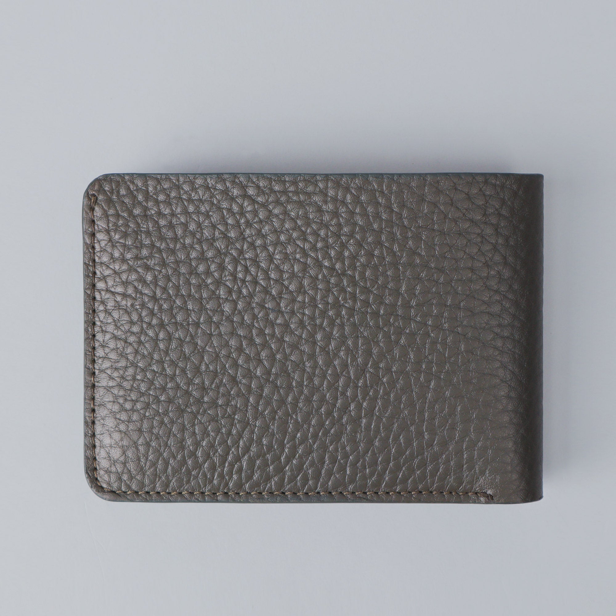 A sleek Minimal Wallet made from premium genuine leather, featuring multiple card slots and a compact design, ideal for everyday use.