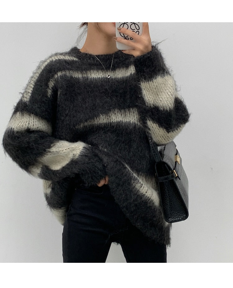 A cozy mohair striped oversized sweater in soft acrylic, featuring a relaxed fit and O-neck collar, perfect for winter wear.