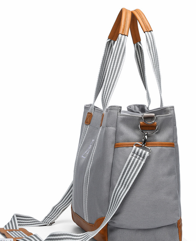 Multifunctional Large-capacity Canvas Portable Mummy Bag in stylish design, showcasing its spacious interior and durable polyester material.