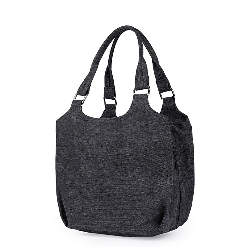A stylish multifunctional portable canvas bag for moms, featuring multiple compartments and available in black, dark gray, and beige.