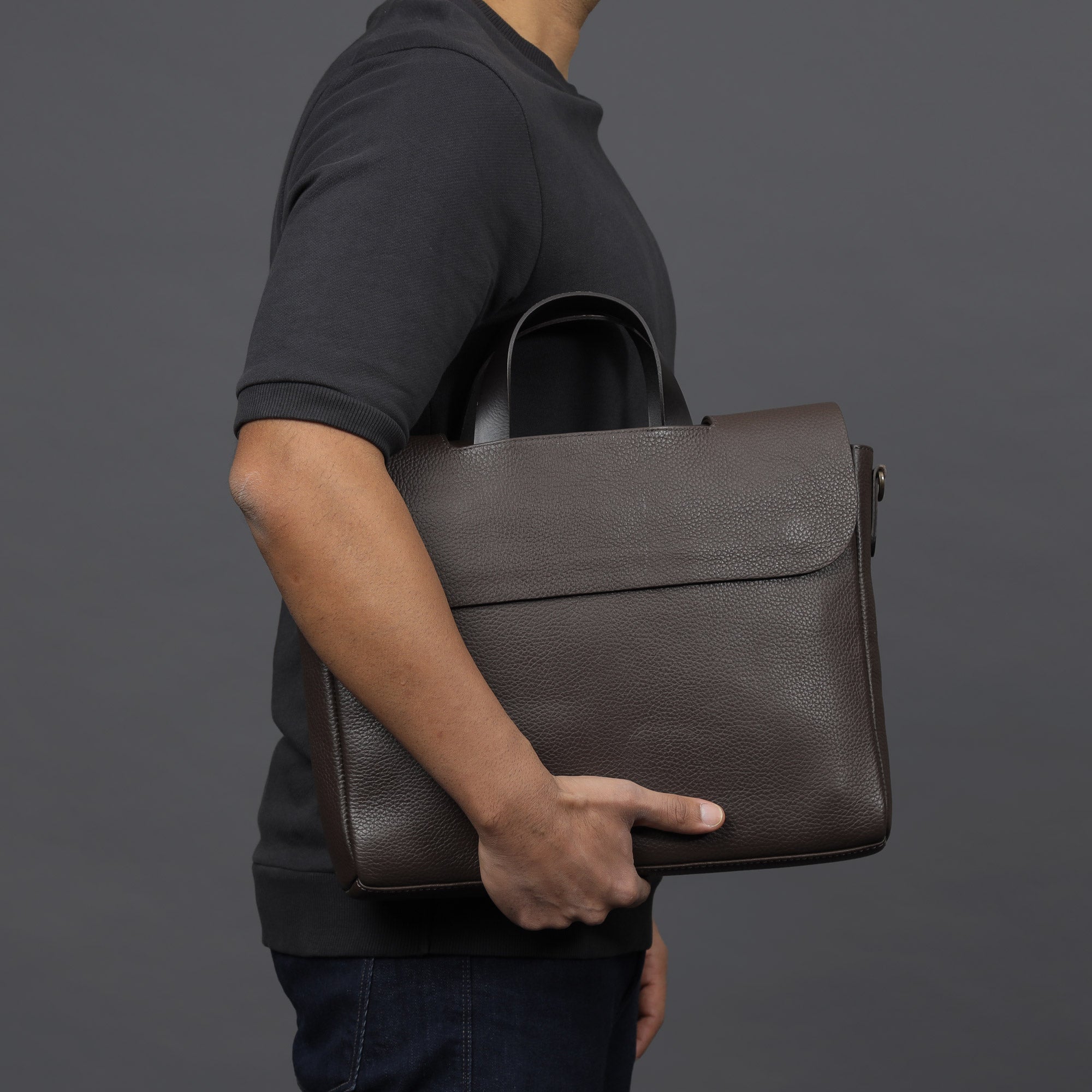 Muse Leather Briefcase made from premium full grain leather, featuring multiple pockets and a sleek design.