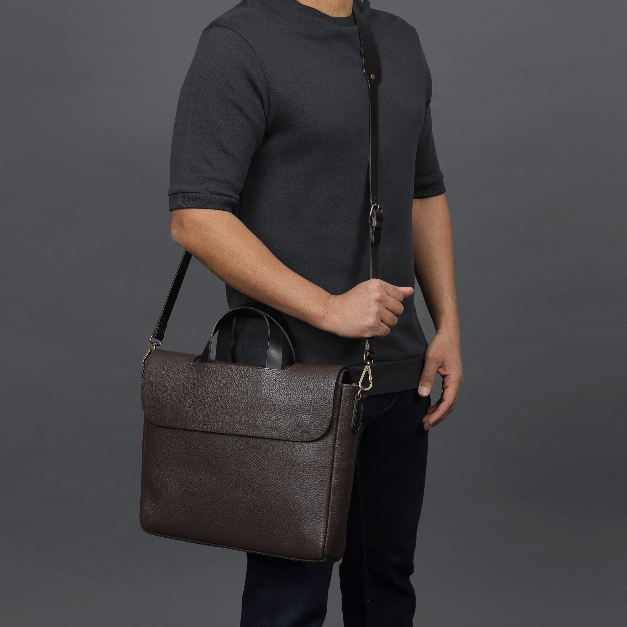 Muse Leather Briefcase made from premium full grain leather, featuring multiple pockets and a sleek design.