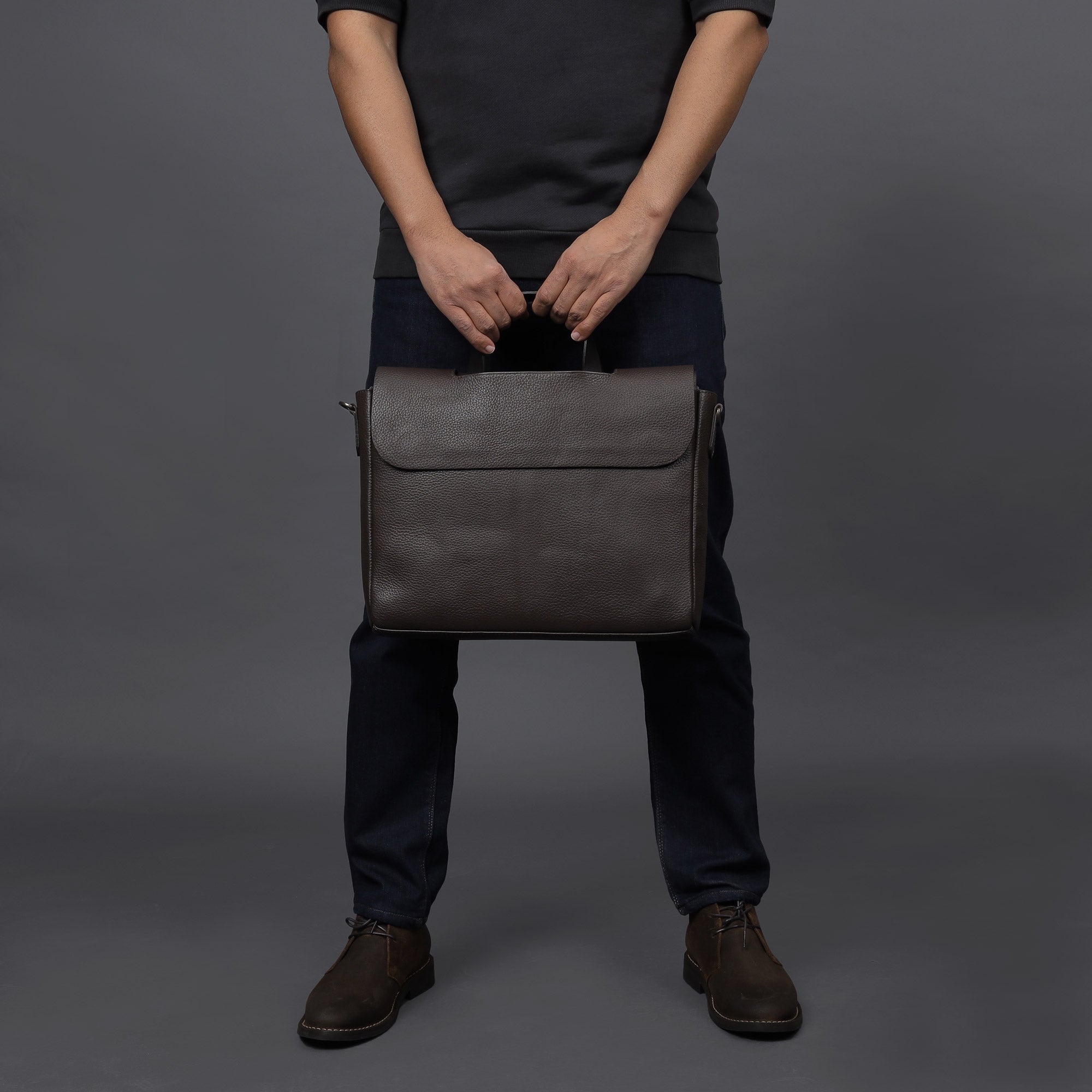 Muse Leather Briefcase made from premium full grain leather, featuring multiple pockets and a sleek design.
