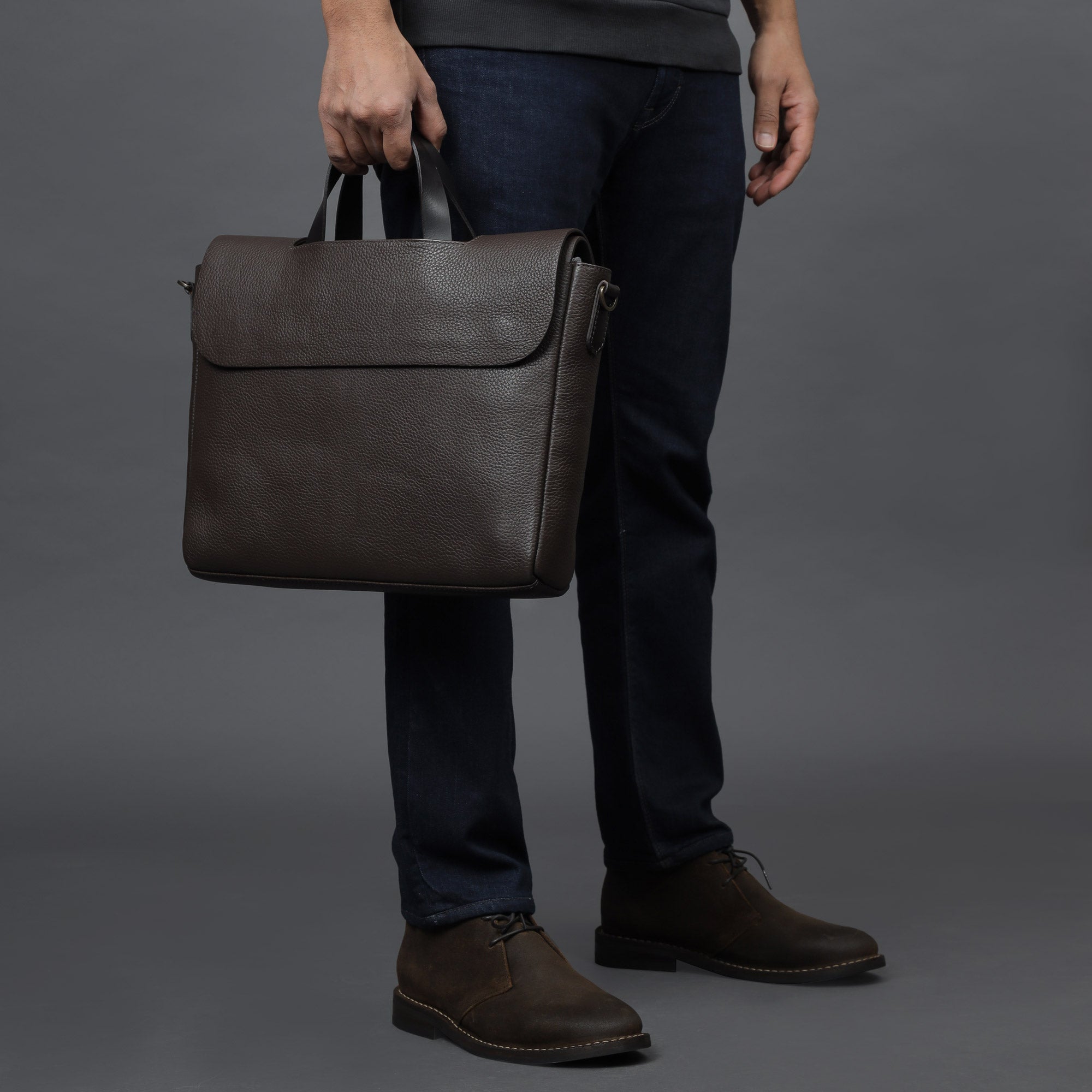 Muse Leather Briefcase made from premium full grain leather, featuring multiple pockets and a sleek design.
