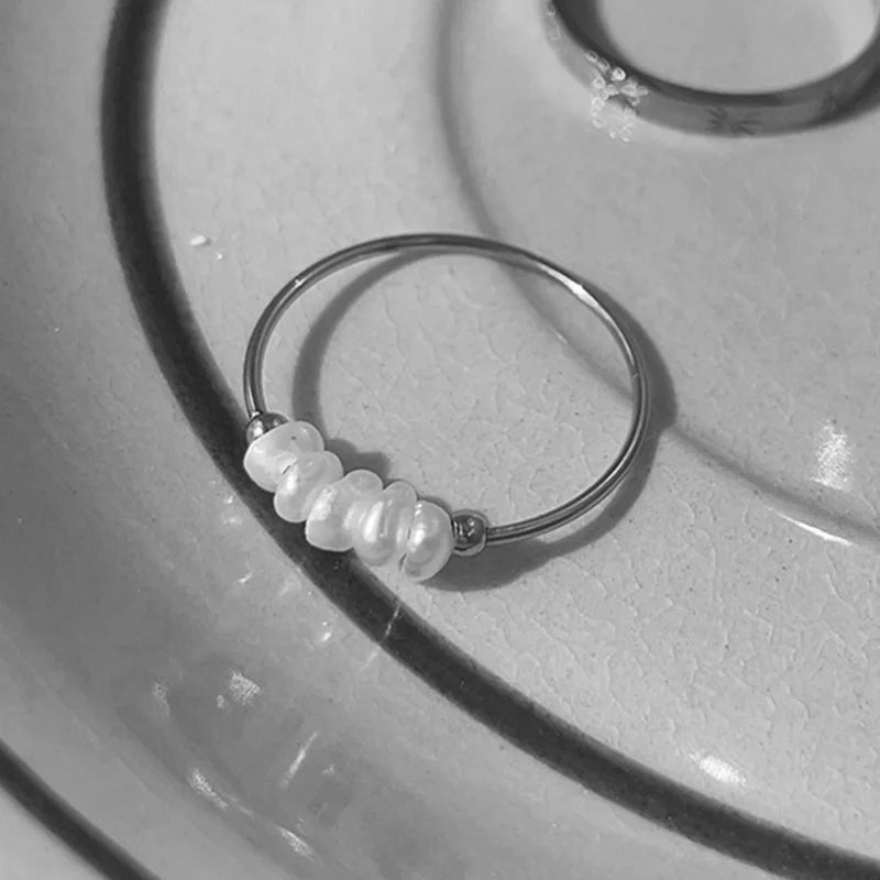 Natural Freshwater Pearl Ring featuring a lustrous pearl set in a durable titanium band, perfect for women.