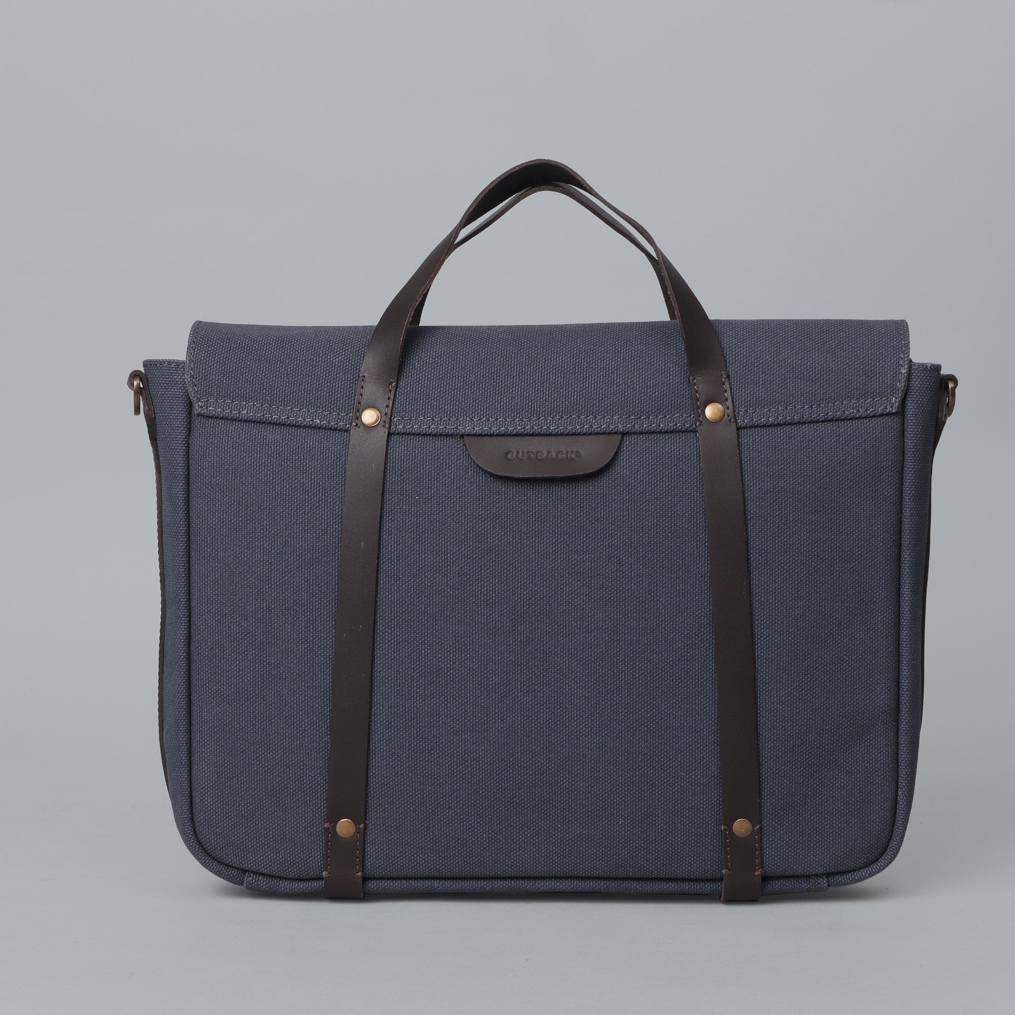 Oslo Canvas Briefcase featuring durable cotton canvas, leather straps, and multiple pockets for organization, ideal for laptops up to 13 inches.