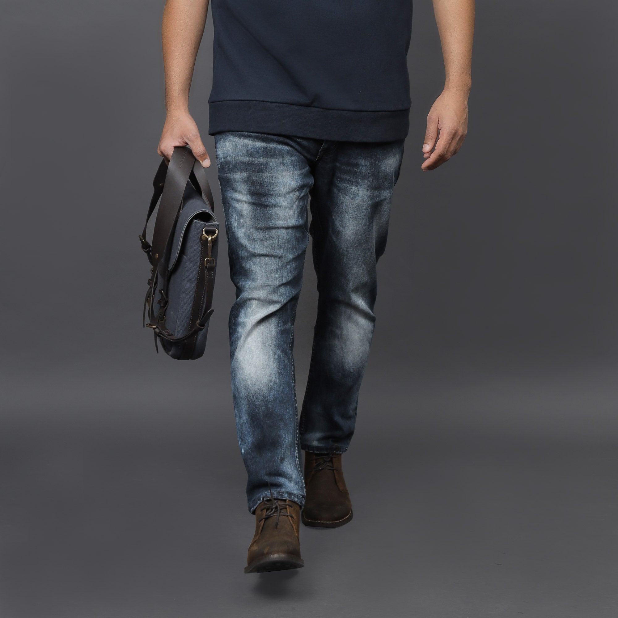 Oslo Canvas Briefcase featuring durable cotton canvas, leather straps, and multiple pockets for organization, ideal for laptops up to 13 inches.