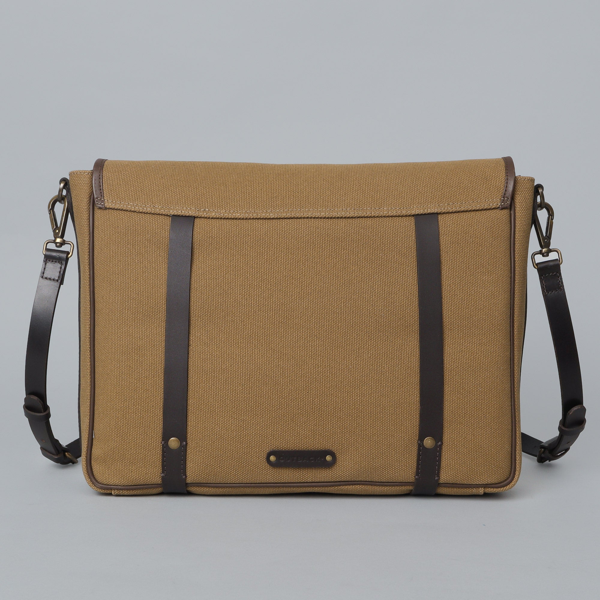 Oslo Canvas Messenger Bag featuring a separate laptop compartment, genuine leather strap, and durable cotton canvas material.