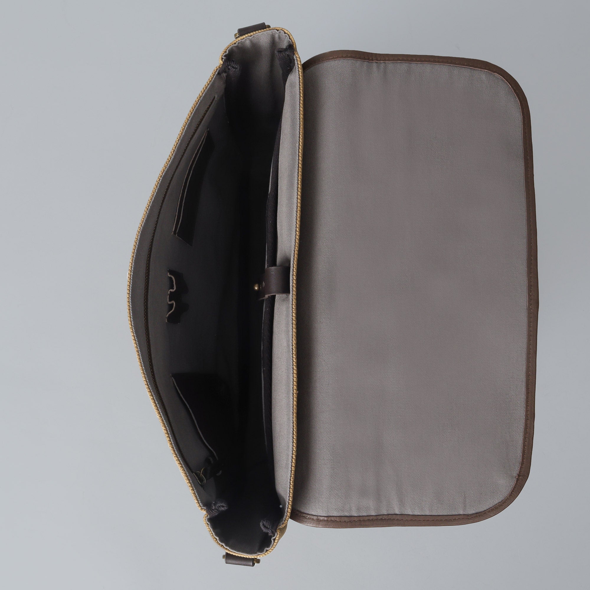 Oslo Canvas Messenger Bag featuring a separate laptop compartment, genuine leather strap, and durable cotton canvas material.