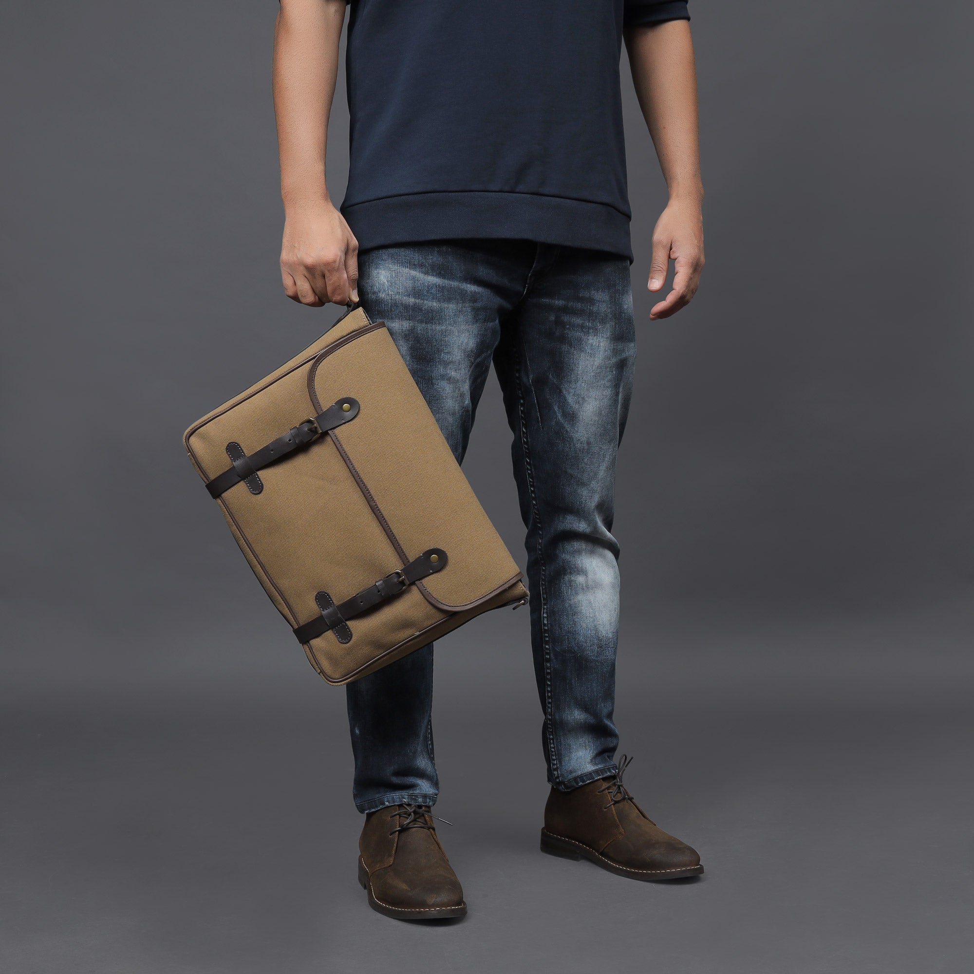 Oslo Canvas Messenger Bag featuring a separate laptop compartment, genuine leather strap, and durable cotton canvas material.