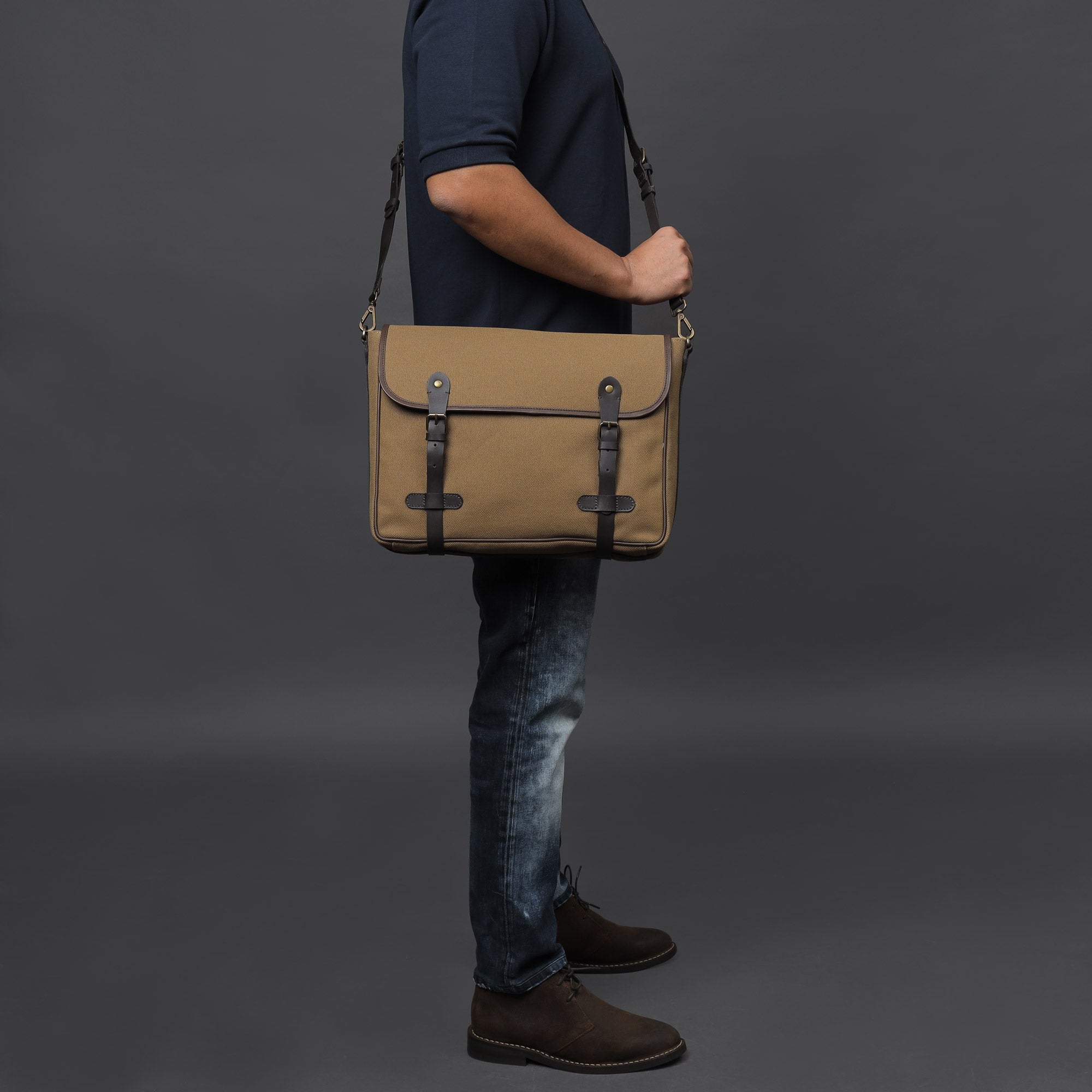 Oslo Canvas Messenger Bag featuring a separate laptop compartment, genuine leather strap, and durable cotton canvas material.