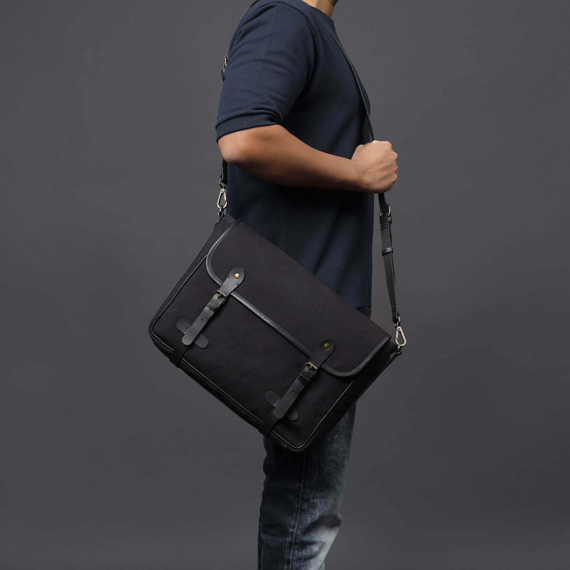 Oslo Canvas Messenger Bag featuring a separate laptop compartment, genuine leather strap, and durable cotton canvas material.