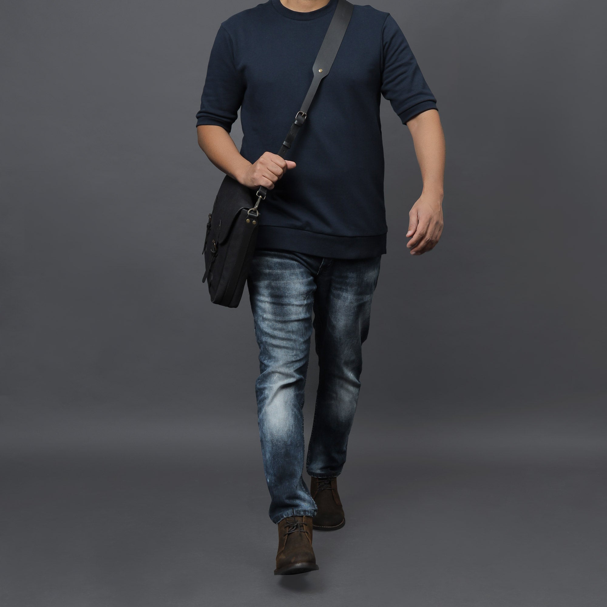 Oslo Canvas Messenger Bag featuring a separate laptop compartment, genuine leather strap, and durable cotton canvas material.