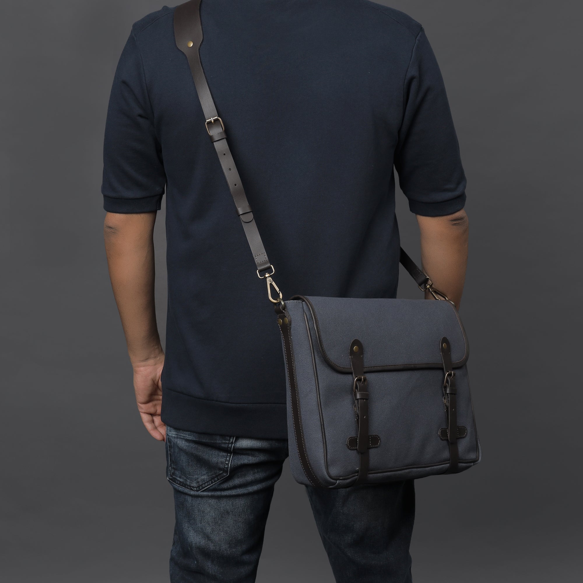 Oslo Canvas Messenger Bag featuring a separate laptop compartment, zipper pocket, and durable cotton canvas material.