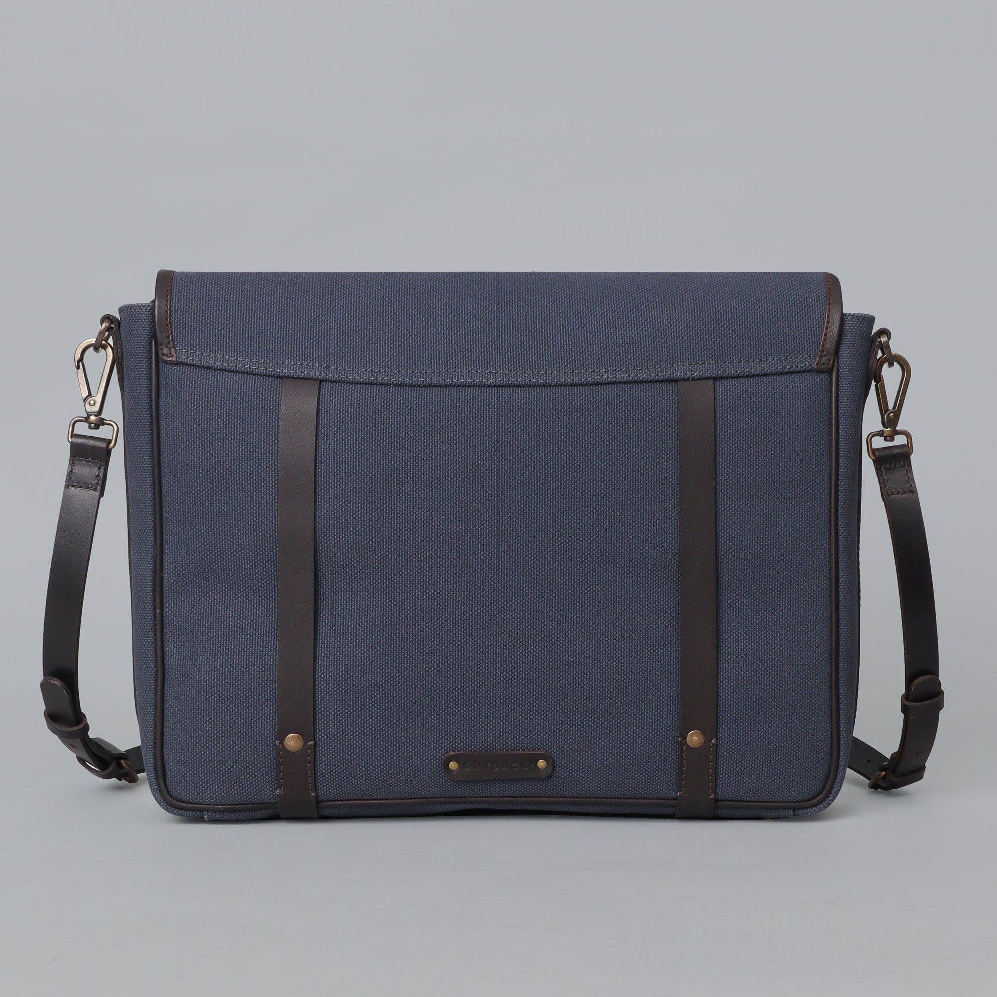 Oslo Canvas Messenger Bag featuring a separate laptop compartment, zipper pocket, and durable cotton canvas material.