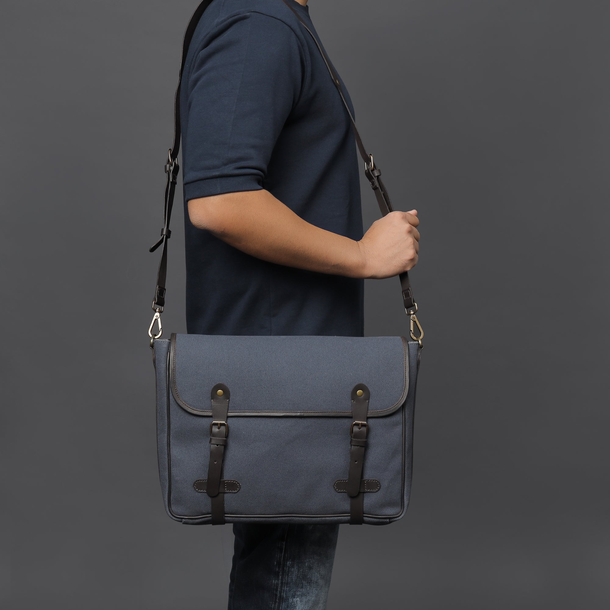 Oslo Canvas Messenger Bag featuring a separate laptop compartment, zipper pocket, and durable cotton canvas material.