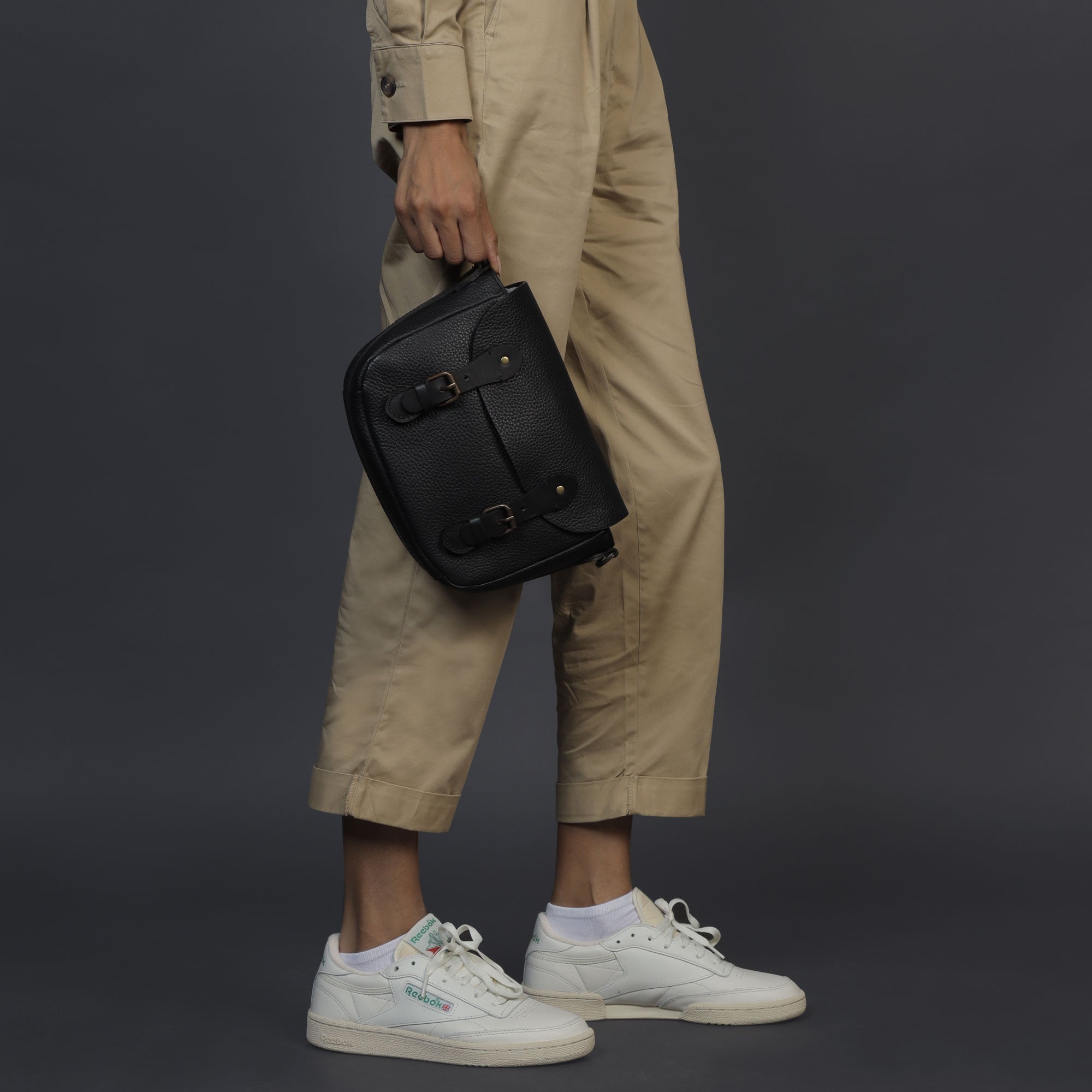 Oslo Crossbody Bag made from premium leather with spacious compartments and antique brass hardware, showcasing its elegant design.