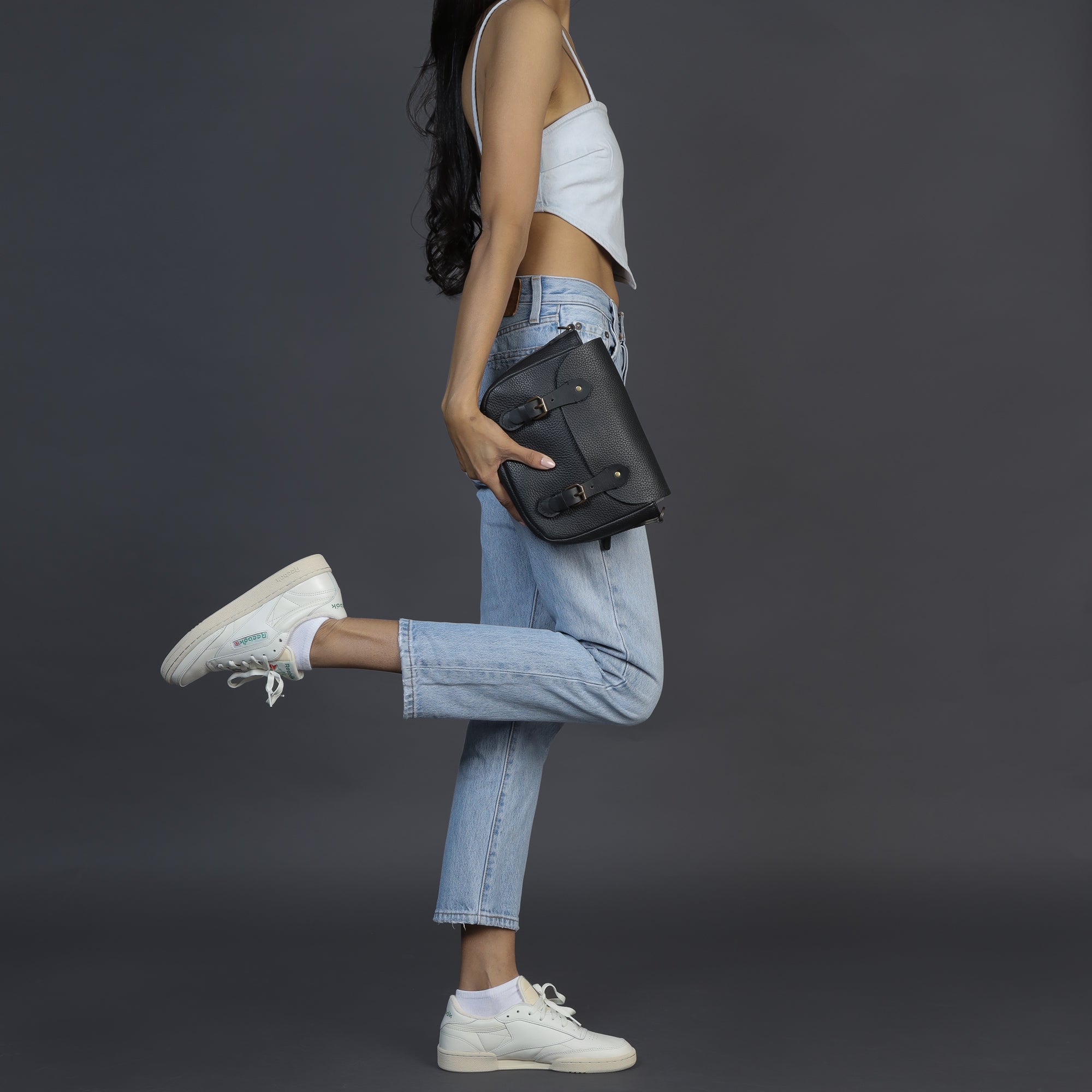 Oslo Crossbody Bag made from premium leather with spacious compartments and antique brass hardware, showcasing its elegant design.